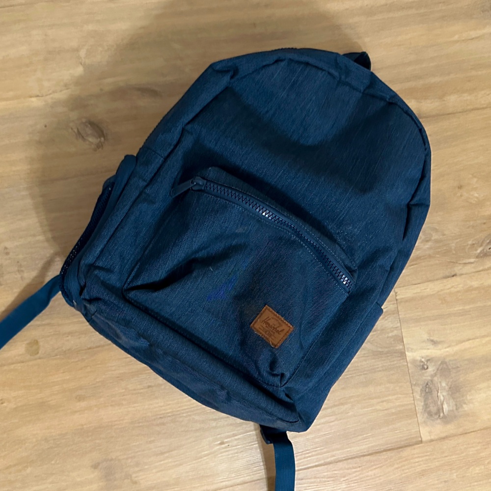 Navy blue Hershchel backpack with diaper changing pad